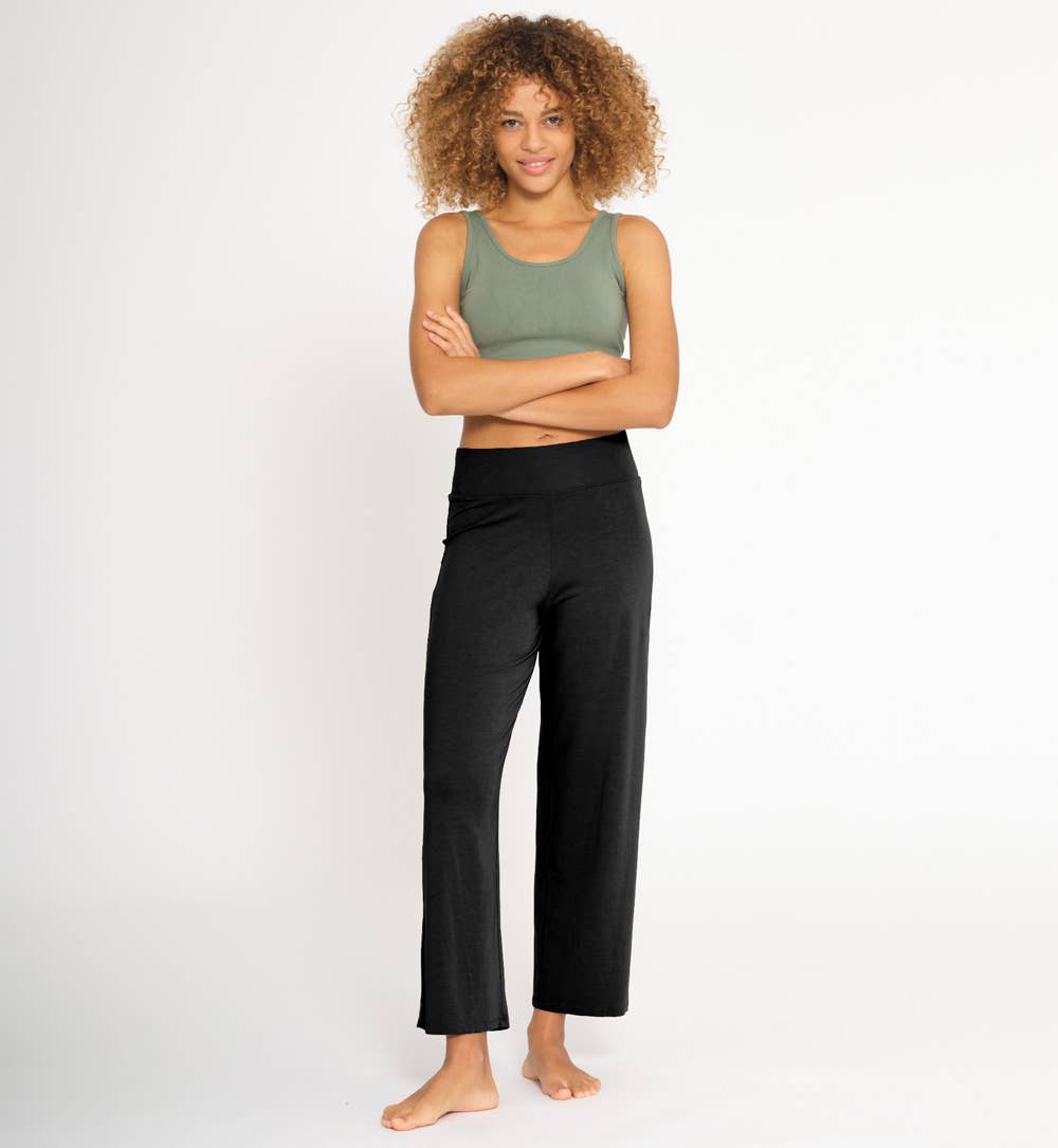 Women wearing black flared cut lyocell fabric yoga pants