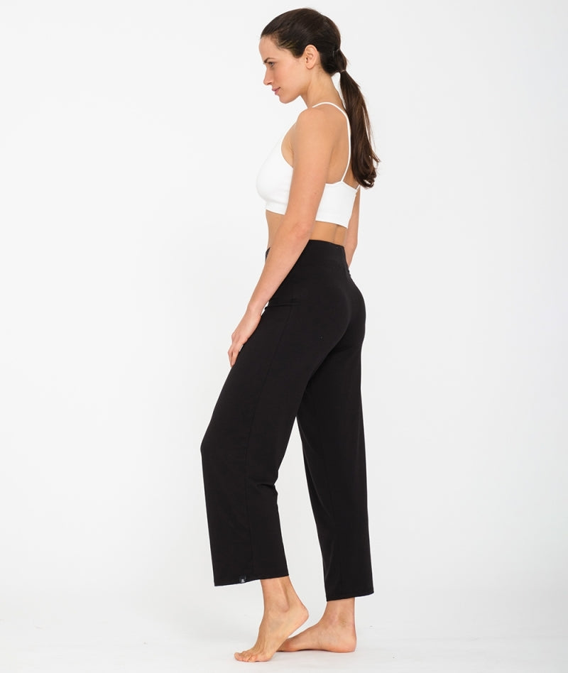 Women wearing black flared cut yoga jersey pants in lyocell & cotton